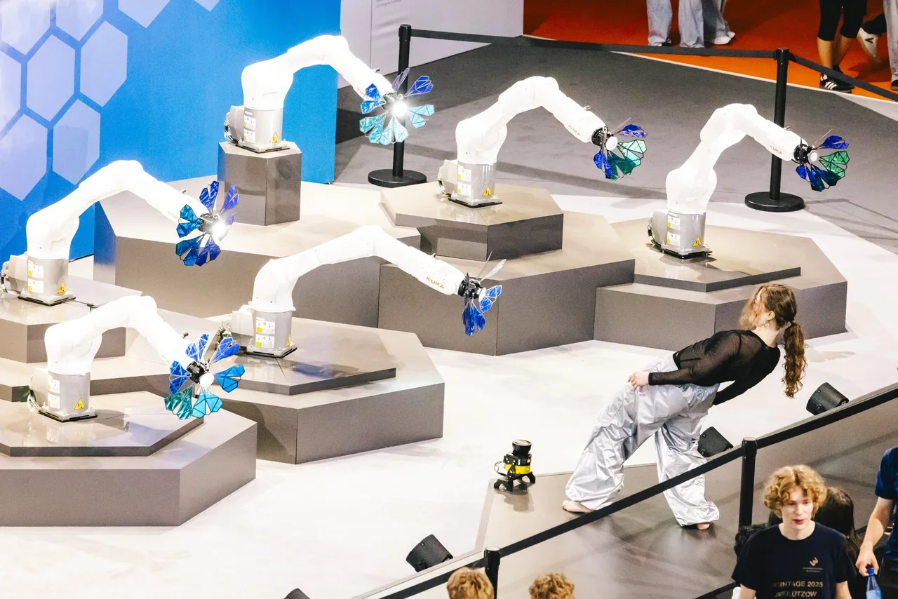 Industrial robots in an interactive exhibition with visitors